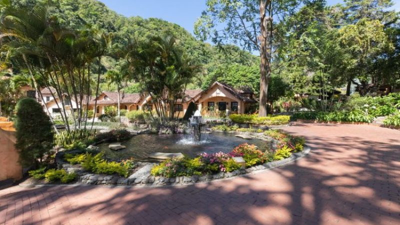 Panama Boquete, tropical gardens with fountain in Valle Escondido park panoramic view